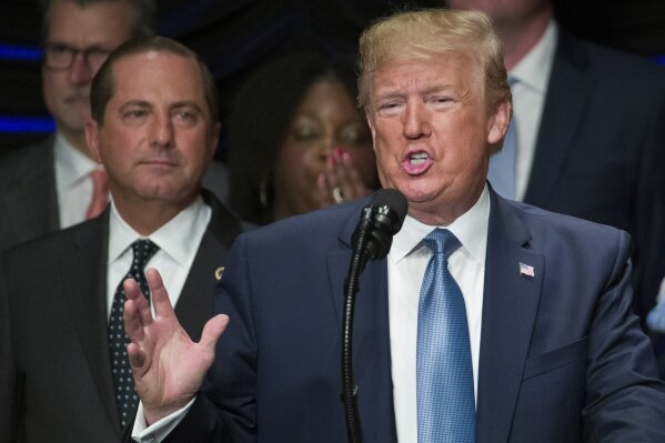 President Donald Trump speaks about kidney health at the Ronald Reagan Building and International Trade Center, accompanied by Health and Human Services Secretary Alex Azar, left, Wednesday, July 10, 2019, in Washington. (AP Photo/Alex Brandon)