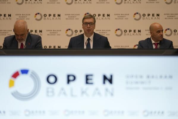 Serbian President Aleksandar Vucic, center, speaks during the "Open Balkan" economic forum for regional cooperation in Belgrade, Serbia, Friday, Sept. 2, 2022. (AP Photo/Darko Vojinovic)