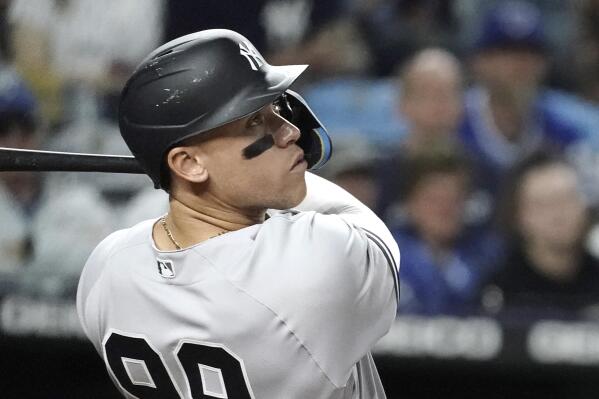 New York Yankees' Aaron Judge watches his three-run home run during the seventh inning of a baseball game against the Kansas City Royals Friday, April 29, 2022, in Kansas City, Mo. (AP Photo/Charlie Riedel)
