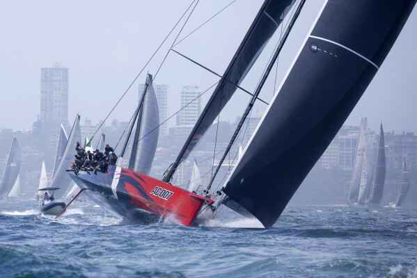 Comanche heads down Sydney Harbour during the start of the Sydney Hobart yacht race in Sydney, Tuesday, Dec. 26, 2023. The 630-nautical mile race has more than 100 yachts starting in the race to the island state of Tasmania. (Salty Dog/CYCA via AP)