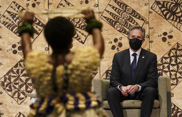 U.S. Secretary of State Antony Blinken watches a cultural farewell ceremony in Nadi, Fiji, Saturday, Feb. 12, 2022. (Kevin Lamarque/Pool Photo via AP)