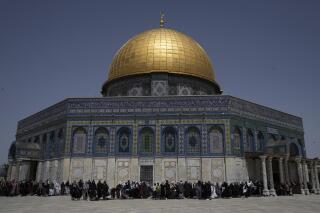 Muslim worshippers gather for Friday prayers by the Dome of Rock at the Al-Aqsa Mosque compound in the Old City of Jerusalem during the Muslim holy month of Ramadan, Friday, April 7, 2023. (AP Photo/Mahmoud Illean)