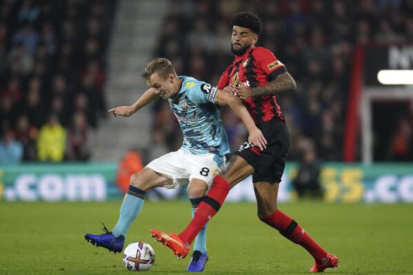 Southampton's James Ward-Prowse, left, and Bournemouth's Philip Billing battle for the ball during the English Premier League soccer match at the Vitality Stadium, Bournemouth, England, Wednesday Oct. 19, 2022. (Adam Davy/PA via AP)