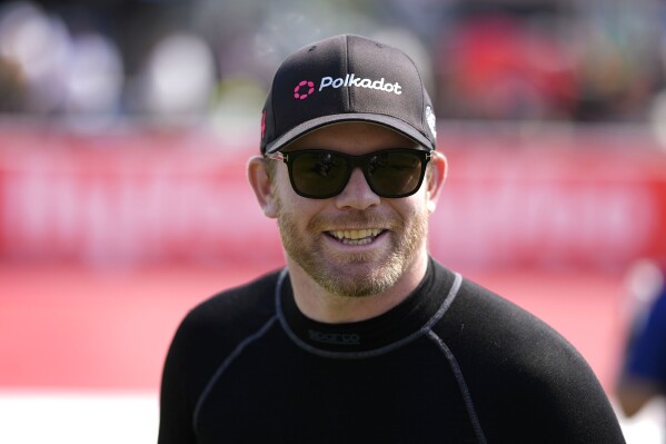 FILE - Conor Daly walks to driver introductions before an IndyCar auto race, Sunday, July 14, 2024, at Iowa Speedway in Newton, Iowa. (AP Photo/Charlie Neibergall)