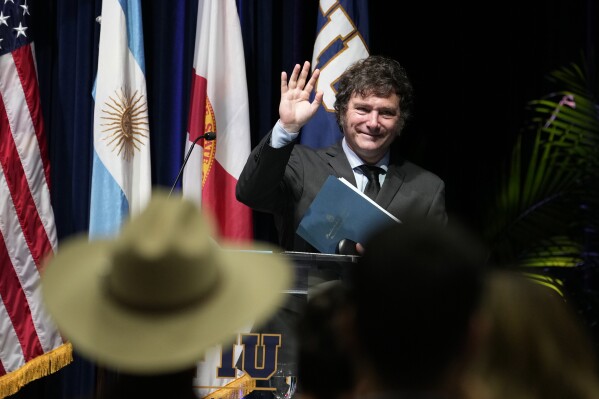 Argentine President Javier Milei waves as he leaves the stage after speaking to students at Florida International University, Thursday, April 11, 2024, in North Miami, Fla. (AP Photo/Lynne Sladky)