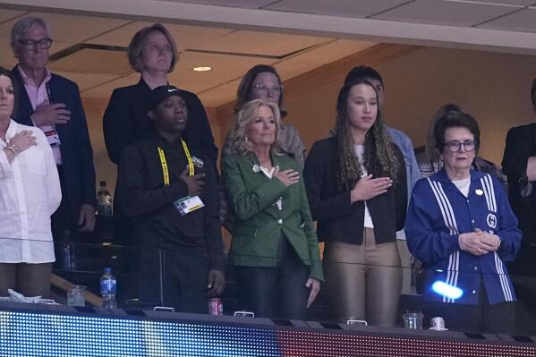 First Lady Jill Biden and other listen to the national anthem before the NCAA Women's Final Four championship basketball game =between LSU and Iowa Sunday, April 2, 2023, in Dallas. (AP Photo/Tony Gutierrez)