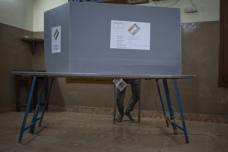 A person casts vote during the first round of voting of India’s national election in Chennai, southern Tamil Nadu state, Friday, April 19, 2024. Nearly 970 million voters will elect 543 members for the lower house of Parliament for five years, during staggered elections that will run until June 1. (AP Photo/Altaf Qadri)