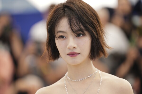 Gengxi Li poses for photographers at the photo call for the film "Resurrection" during the 78th international film festival in Cannes, southern France, Friday, May 23, 2025. (AP Photo/Natacha Pisarenko)