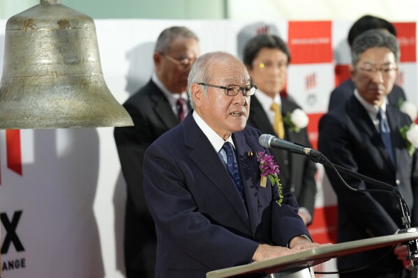 Shunichi Suzuki, Japanese finance minister, delivers speech during a ceremony marking the start of this year's trading at the Tokyo Stock Exchange Thursday, Jan. 4, 2024, in Tokyo. Asian stocks plunged Thursday, echoing the pessimism on Wall Street as the Tokyo exchange marked the first day of trading for the year with a broad slide. (AP Photo/Eugene Hoshiko)