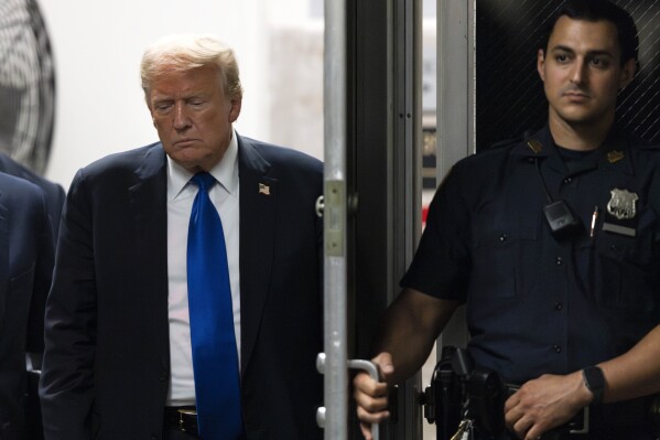 Former President Donald Trump returns to the courthouse moments before hearing that the jury had a verdict in his criminal trial at Manhattan Criminal Court, Thursday, May 30, 2024, in New York. (Justin Lane/Pool Photo via AP)
