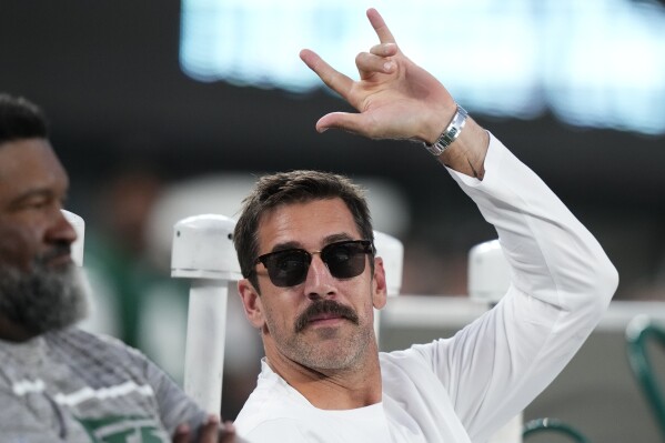 New York Jets quarterback Aaron Rodgers waves to football fans before an NFL football game between the Jets and the Kansas City Chiefs, Sunday, Oct. 1, 2023, in East Rutherford, N.J. (AP Photo/Frank Franklin II)
