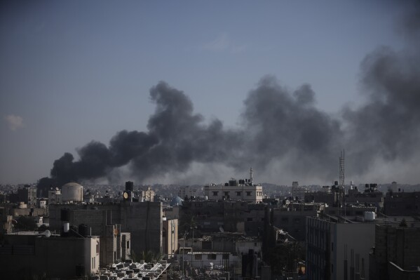 Smoke rises after an Israeli strike in Khan Younis, Gaza Strip, Saturday, Jan. 6, 2024. (AP Photo/Mohammed Dahman)