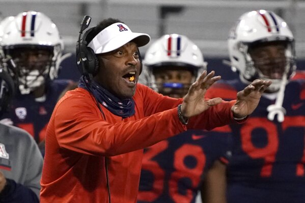 In this Friday, Dec. 11, 2020, photo, Arizona coach Kevin Sumlin reacts during the first half of ...