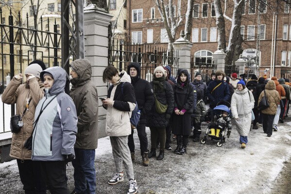 People queue to vote, outside the Russian Embassy in Helsinki, Finland, Sunday March 17, 2024. Russians at home and abroad headed to the polls for a presidential election that was all but certain to extend President Vladimir Putin's rule after he clamped down on dissent. (Roni Rekomaa/Lehtikuva via AP)