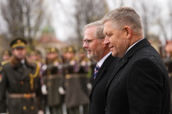 Czech Republic's Prime Minister Petr Fiala welcomes his Slovakia counterpart Robert Fico, right, to Prague, Czech Republic, Friday, Nov. 24, 2023. (AP Photo/Petr David Josek)