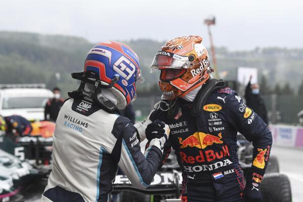 First place for pole position Red Bull driver Max Verstappen of the Netherlands, right, congratulates second place, Williams driver George Russell of Britain after the qualification ahead of the Formula One Grand Prix at the Spa-Francorchamps racetrack in Spa, Belgium, Saturday, Aug. 28, 2021. The Belgian Formula One Grand Prix will take place on Sunday. (John Thys, Pool Photo via AP)