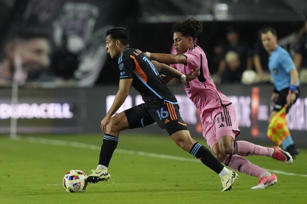 New York City FC forward Alonso Martínez (16) runs with the ball as Inter Miami midfielder David Ruiz (41) defends during the first half of an MLS soccer match, Saturday, March 30, 2024, in Fort Lauderdale, Fla. (AP Photo/Marta Lavandier)