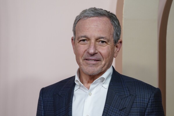 FILE - Disney chief executive Bob Iger arrives at the 96th Academy Awards Oscar nominees luncheon on Feb. 12, 2024, in Beverly Hills, Calif. During the company's annual shareholder meeting Wednesday, April 3, 2024, investors will decide whether to back Iger, or grant two board seats to activist investor Nelson Peltz and his Trian Partners. (Photo by Jordan Strauss/Invision/AP, File)