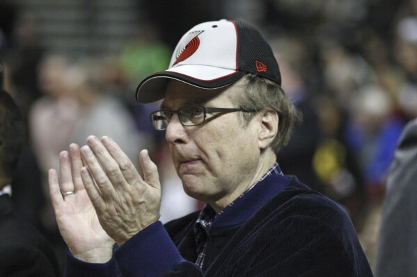 Paul Allen, the owner of Seattle Seahawks and the Portland Trail Blazers, waits for the start of an NBA basketball game, April 18, 2012, in Portland, Ore. (AP Photo/Rick Bowmer, file)