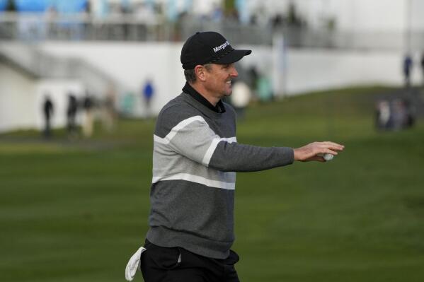 Justin Rose, of England, reacts after making an eagle putt on the sixth green of the Pebble Beach Golf Links during the fourth round of the AT&T Pebble Beach Pro-Am golf tournament in Pebble Beach, Calif., Sunday, Feb. 5, 2023. (AP Photo/Godofredo A. Vásquez)