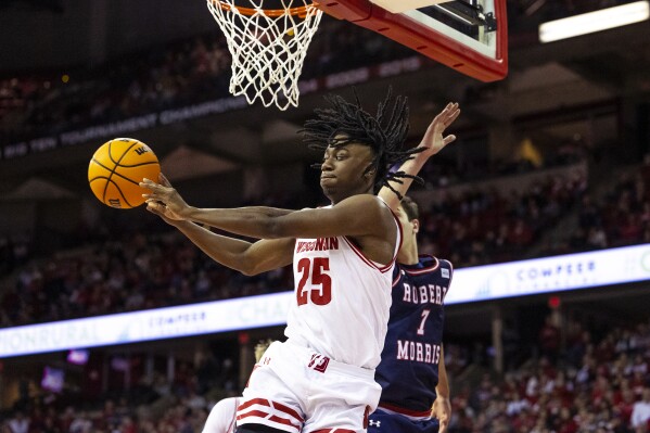 Wisconsin guard John Blackwell (25) passes the ball during the second half of an NCAA college basketball game against Robert Morris in Madison, Wis., Friday, Nov. 17, 2023. (Samantha Madar/Wisconsin State Journal via AP)