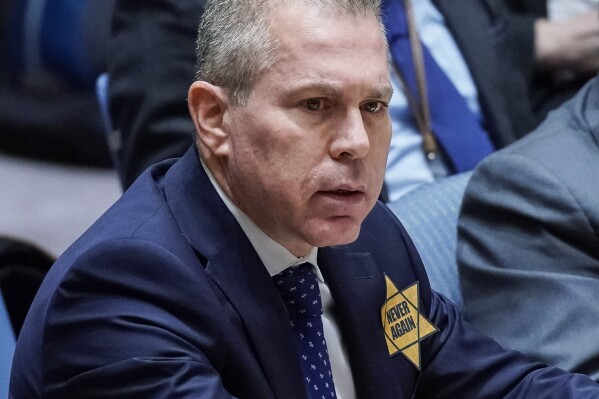 Israel’s U.N. Ambassador Gilad Erdan wears a yellow Star of David that reads 