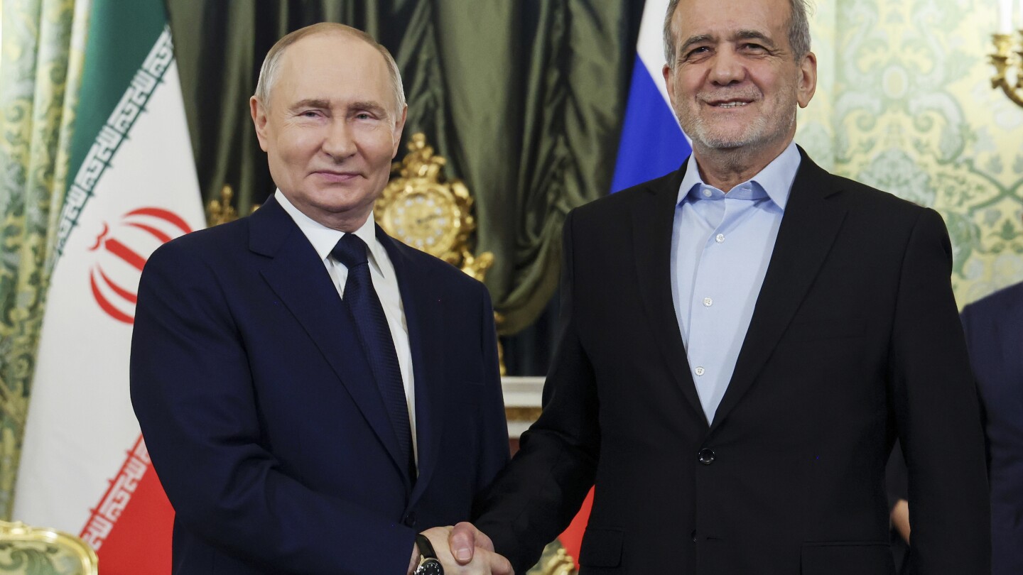 Presidents of Russia and Iran meet within the Kremlin to signal partnership treaty