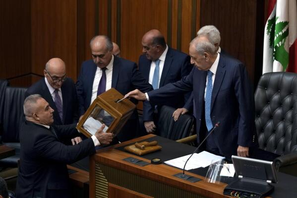 Lebanese Parliament Speaker Nabih Berri, right, casts his vote as parliament gathers to elect a president at the parliament building in downtown Beirut, Lebanon, Thursday, Sept. 29, 2022. Lebanon's Parliament on Thursday failed to elect a new president with the majority of lawmakers casting blank ballots. (AP Photo/Bilal Hussein)