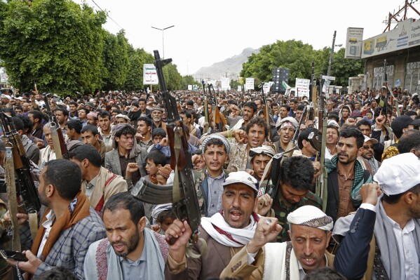 Houthi supporters chant slogans as they attend a rally marking eight years for a Saudi-led coalition, on March 26, 2023, in Sanaa, Yemen. (AP Photo/Hani Mohammed)