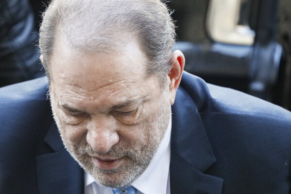 Harvey Weinstein arrives at a Manhattan courthouse for his rape trial, Monday, Feb. 24, 2020, in New York.  A jury convicted the Hollywood mogul of rape and sexual assault. The jury found him not guilty of the most serious charge, predatory sexual assault, which could have resulted in a life sentence.(AP Photo/John Minchillo)