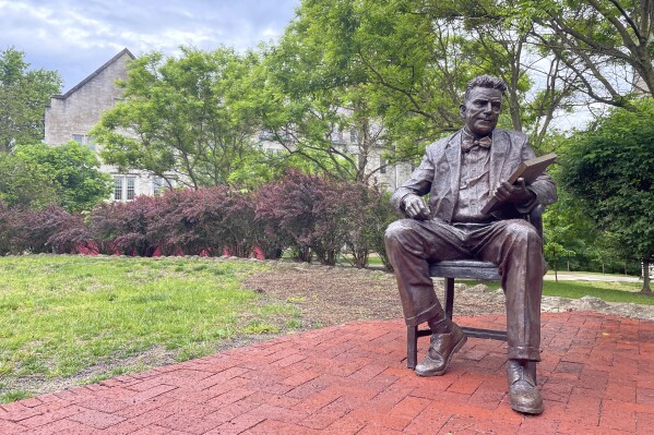 FILE - A bronze sculpture of Alfred Kinsey, a sex researcher who founded Indiana University's branch of sex research, the Kinsey Institute, sits outside the institute's research facility, Tuesday, May 16, 2023, in Bloomington, Ind. (APPhoto/Arleigh Rodgers, File)