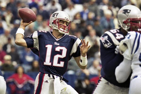 FILE - In this Sept. 30, 2001 file photo, New England Patriots quarterback Tom Brady (12) passes during Brady's first start of an NFL football game against the Indianapolis Colts in Foxborough, Mass. Brady, who won a record seven Super Bowls for New England and Tampa, has announced his retirement, Wednesday, Feb. 1, 2023. (AP Photo/Winslow Townson, File)
