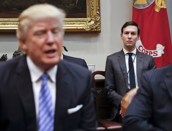 
              FILE - In this Jan. 23, 2017, file photo, White House Senior Adviser Jared Kushner listens at right as President Donald Trump speaks during a breakfast with business leaders in the Roosevelt Room of the White House in Washington. Kushner has been a power player able to avoid much of the harsh scrutiny that comes with working in the White House, but he's found that even the president's son-in-law takes his turn in the spotlight. (AP Photo/Pablo Martinez Monsivais, File)
            