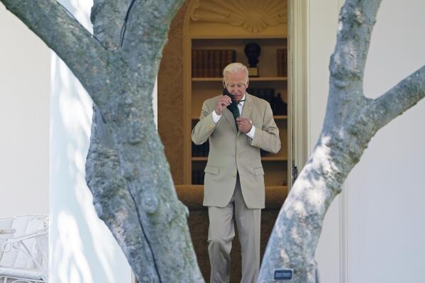 In this Aug. 6, 2021, photo, President Joe Biden walks out of the Oval Office and heads to Marine One on the South Lawn of the White House in Washington, as he heads to Wilmington, Del., for the weekend. Biden should be heading out on vacation and a traditional August break from Washington. But with the Senate still in session and working on his bipartisan infrastructure bill for the second straight weekend, and likely into next week, Biden hasn’t gone far. (AP Photo/Susan Walsh)