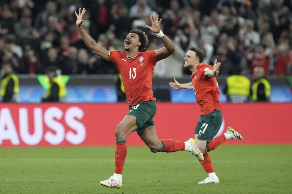 Portugal's Renato Veiga celebrates after winning the Nations League final soccer match between Portugal and Spain at the Allianz Arena in Munich, Germany, Sunday, June 8, 2025. (AP Photo/Martin Meissner)