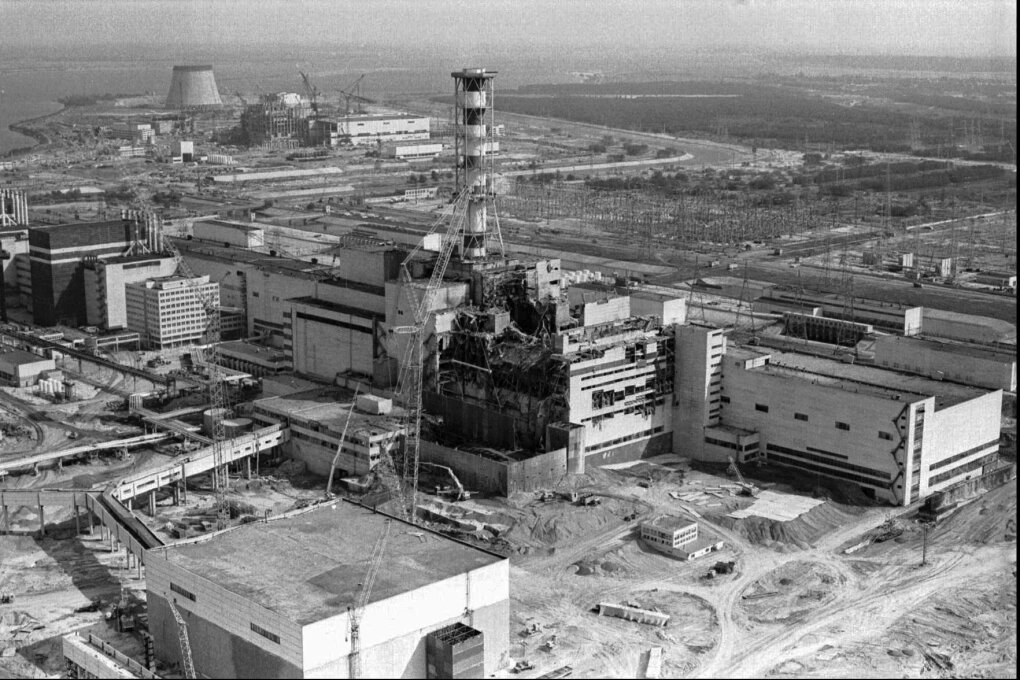 FILE - A 1986 file photo of an aerial view of the Chernobyl nuclear plant in Chernobyl, Ukraine showing damage from an explosion and fire in reactor four on April 26, 1986 that sent large amounts of radioactive material into the atmosphere. Telling the story of Chernobyl in numbers 30 years later involves dauntingly large figures and others that are even more vexing because they're still unknown. (AP Photo/Volodymyr Repik, File)