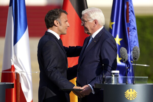 German President Frank-Walter Steinmeier, right, and French President Emmanuel at the end of a press conference at Bellevue Place in Berlin, Germany, Sunday, May 26, 2024. (AP Photo/Markus Schreiber)