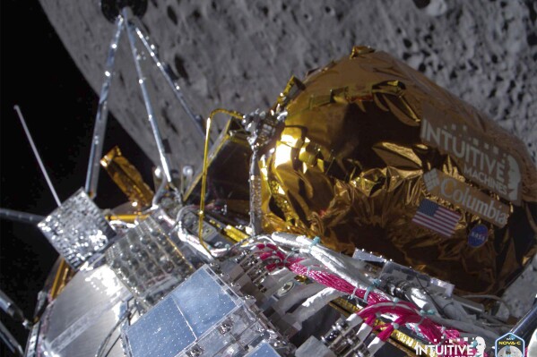 FILE - This image provided by Intuitive Machines shows its Odysseus lunar lander over the near side of the moon following lunar orbit insertion, Wednesday, Feb. 21, 2024. Intuitive Machines reported Friday, Feb. 23, 2024, that it’s communicating with its lander, Odysseus, and sending commands to acquire science data. But it noted: “We continue to learn more about the vehicle’s specific information” regarding location, overall health and positioning. (Intuitive Machines via AP, File)