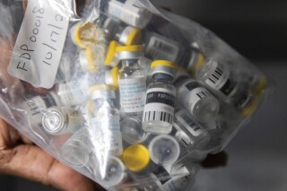 FILE - Vials of single doses of the Jynneos vaccine for monkeypox are seen from a cooler at a vaccinations site on Aug. 29, 2022, in the Brooklyn borough of New York. The World Health Organization said it has confirmed sexual transmission of mpox in Congo for the first time during the country's biggest-ever outbreak, in a worrying development African scientists warn could make it more difficult to stop the disease. (AP Photo/Jeenah Moon, File)