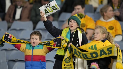 Australia fans cheer on the stands before the Women's World Cup soccer match between Australia and Ireland at Stadium Australia in Sydney, Australia, Thursday, July 20, 2023. (AP Photo/Mark Baker)