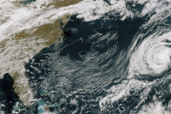This GOES-East GeoColor satellite image taken Friday, Oct. 27, 2023 at 12:36 p.m. EDT., and provided by NOAA, shows Tropical Storm Tammy, right. Forecasters say Tammy has gained strength over the Atlantic Ocean and redeveloped into a tropical storm. The storm around midday was about 215 miles (350 kilometers) east of Bermuda, with maximum sustained winds of 65 mph (100 kph), the National Hurricane Center said. It was moving northwest at 3 mph (6 kph). (NOAA via AP)