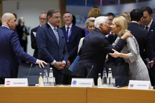 European Council President Antonio Costa, center left, greets European Union foreign policy chief Kaja Kallas as they arrive for a round table meeting at an EU Summit in Brussels, Thursday, March 6, 2025. (AP Photo/Geert Vanden Wijngaert)