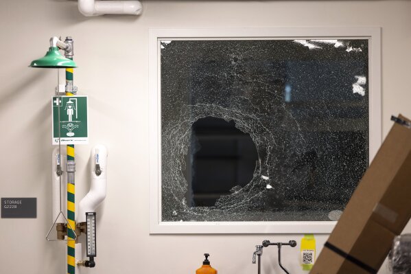 A shattered window is seen inside the Interdisciplinary Engineering Building on University of Washington's campus after pro-Palestinian protesters occupied the building, Tuesday, May 6, 2025, in Seattle. (Nick Wagner/The Seattle Times via AP)