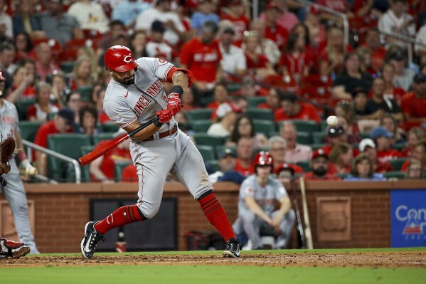 Cincinnati Reds' Christian Encarnacion-Strand bats for a three-run home run during the fourth inning of a baseball game against the St. Louis Cardinals, Friday, Sept. 29, 2023, in St. Louis. (AP Photo/Scott Kane)