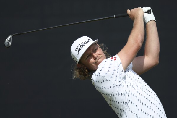 Australia's Cameron Smith plays his shot from the 3rd tee during the second day of the British Open Golf Championships at the Royal Liverpool Golf Club in Hoylake, England, Friday, July 21, 2023. (AP Photo/Peter Morrison)