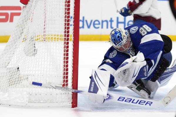 Tampa Bay Lightning goaltender Andrei Vasilevskiy (88) makes a diving save on a shot by the Colorado Avalanche during the first period of an NHL hockey game Thursday, Feb. 9, 2023, in Tampa, Fla. (AP Photo/Chris O'Meara)