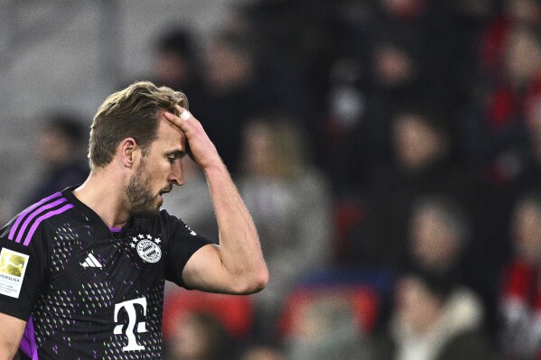 Munich's Harry Kane reacts during the Bundesliga soccer match between SC Freiburg and Bayern Munich at the Europa-Park Stadium in Freiburg Im Breisgau, Germany, Friday March 1, 2024. (Tom Weller/dpa via AP)