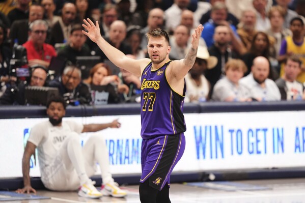 Los Angeles Lakers' Luka Doncic (77) reacts to play in the second half of an NBA basketball game against the Dallas Mavericks in Dallas, Wednesday, April 9, 2025. (AP Photo/LM Otero)