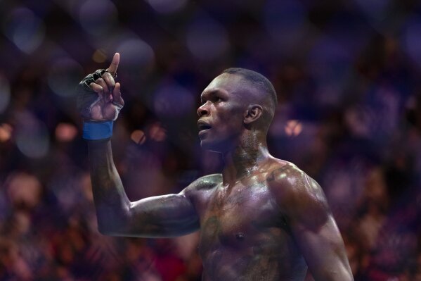 FILE - Israel Adesanya reacts after knocking out Alex Pereira in their middleweight title match during the UFC 287 event at the Kaseya Center on April 8, 2023, in downtown Miami. (Matias J. Ocner/Miami Herald via AP, File)