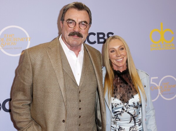 FILE - Tom Selleck, left, and Jillie Mack appear at the "The Carol Burnett 50th Anniversary Special" in Los Angeles on Oct. 4, 2017. (Photo by Willy Sanjuan/Invision/AP, File)